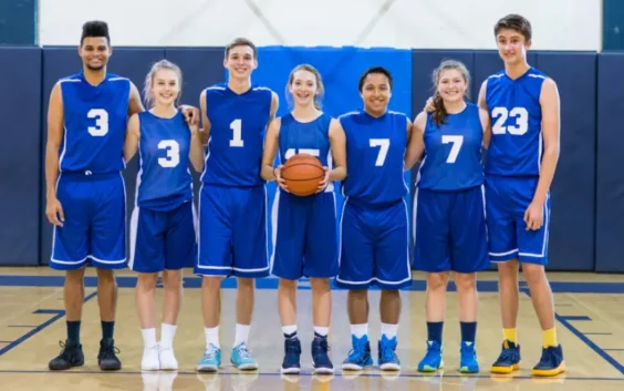 a team of boys and girls in a basketball team